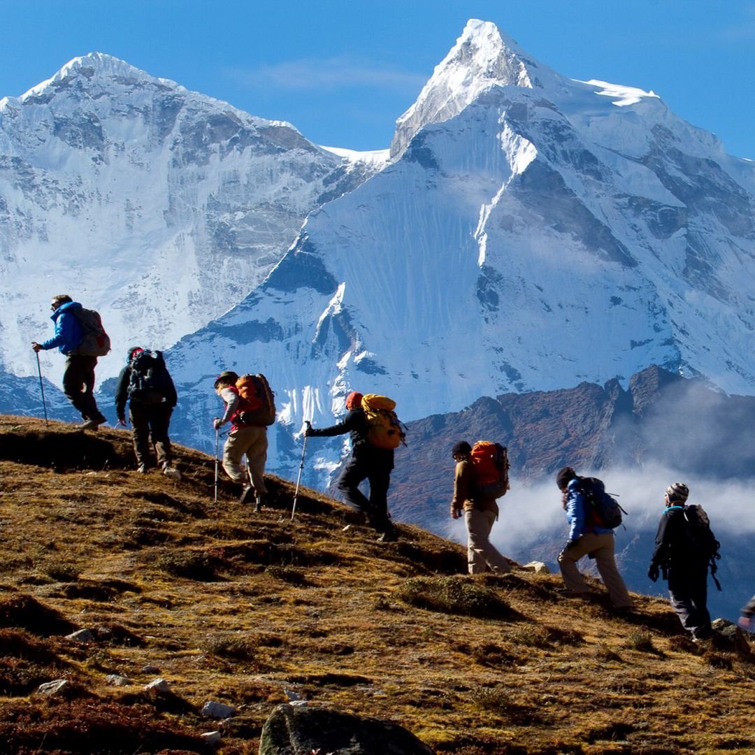 Trekkers looking at Himalayan mountains